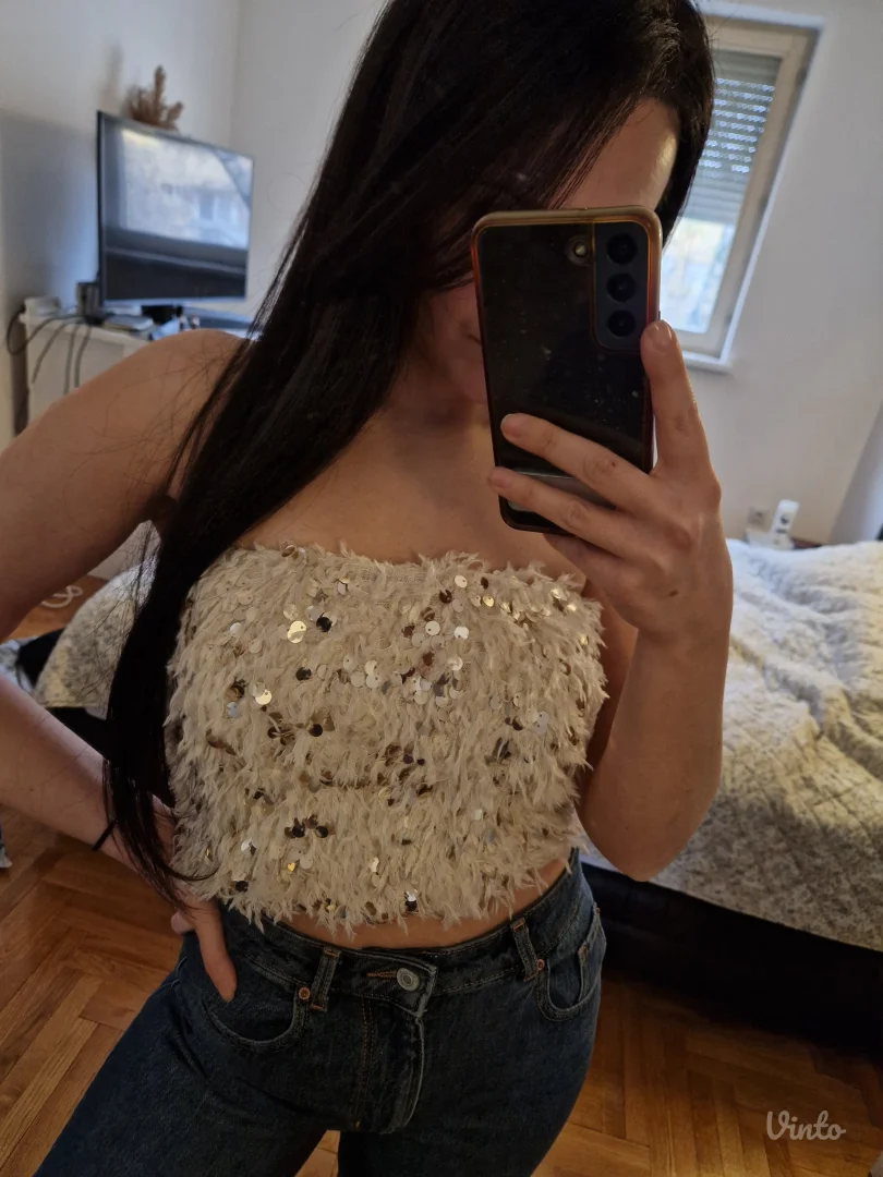 Top od perja i sljokica