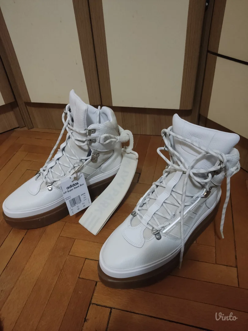 Ivy Park super sleek boots in white.