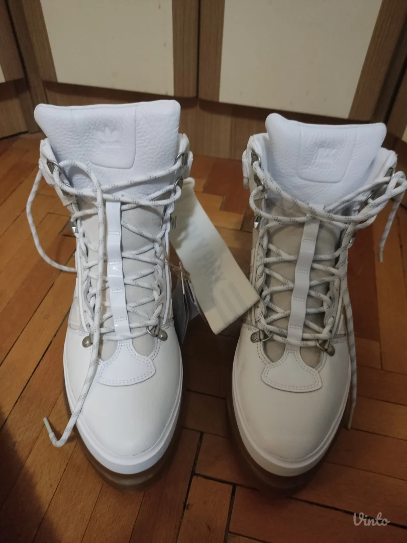 Ivy Park super sleek boots in white.