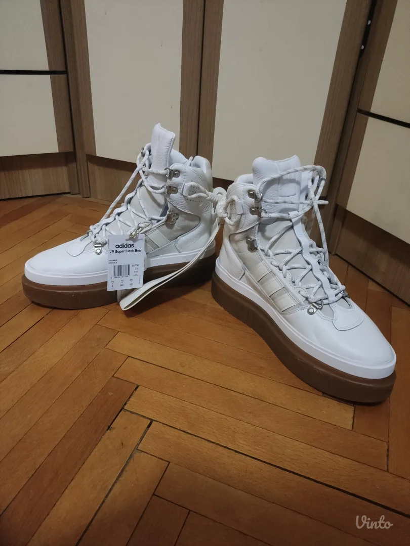 Ivy Park super sleek boots in white.