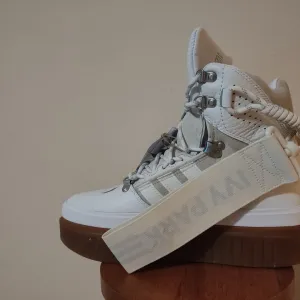 Ivy Park super sleek boots in white.