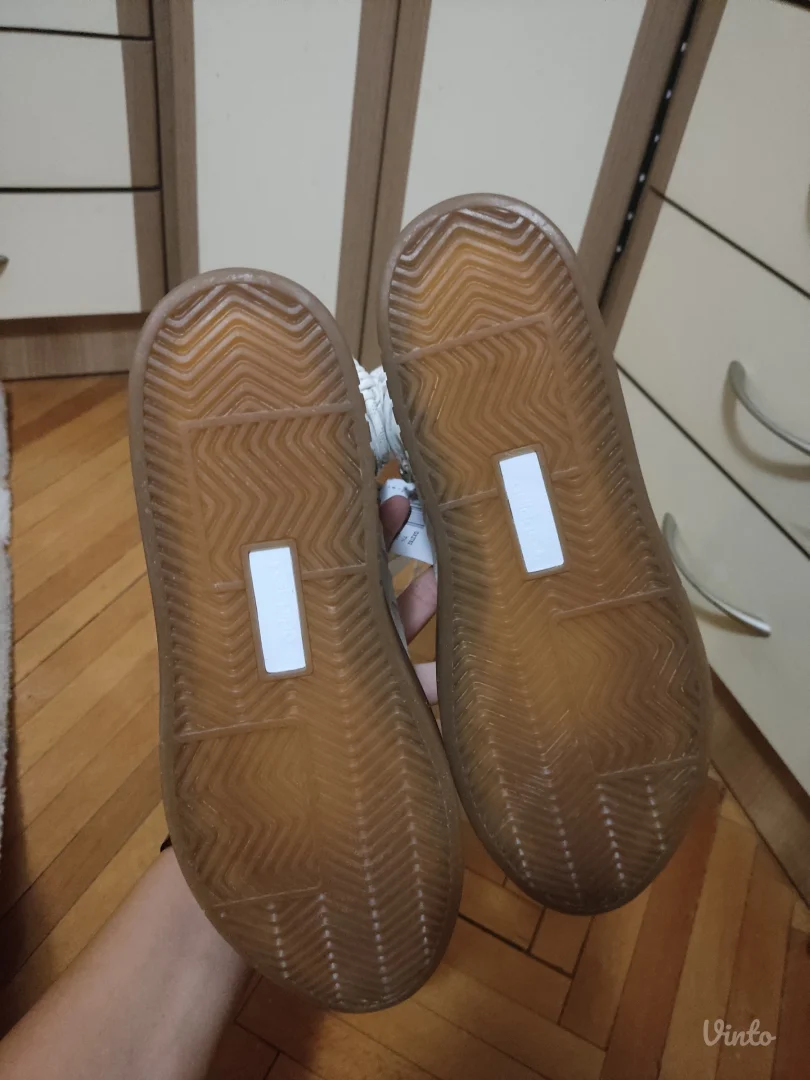 Ivy Park super sleek boots in white.