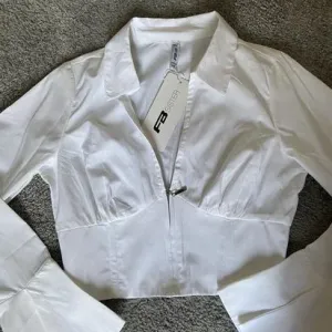 New Yorker korset kosulja