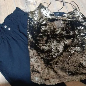 Pantalone i šljokičasta bluza