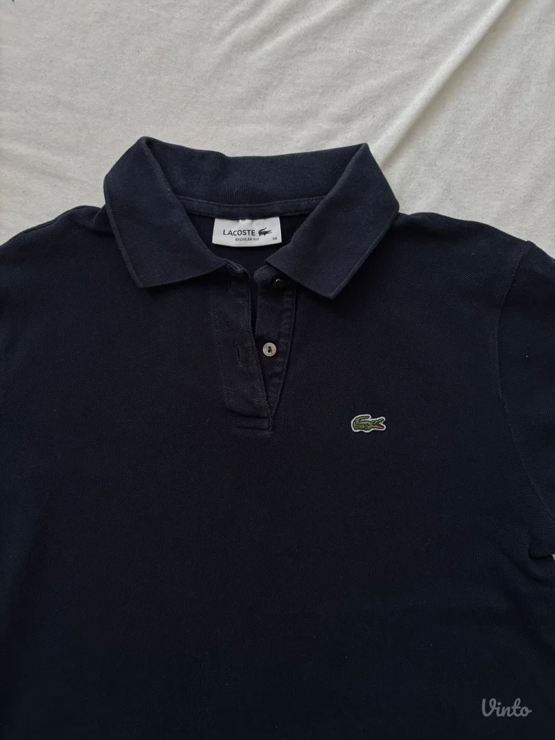 Lacoste teget ženska polo majica (Vel. 38)
