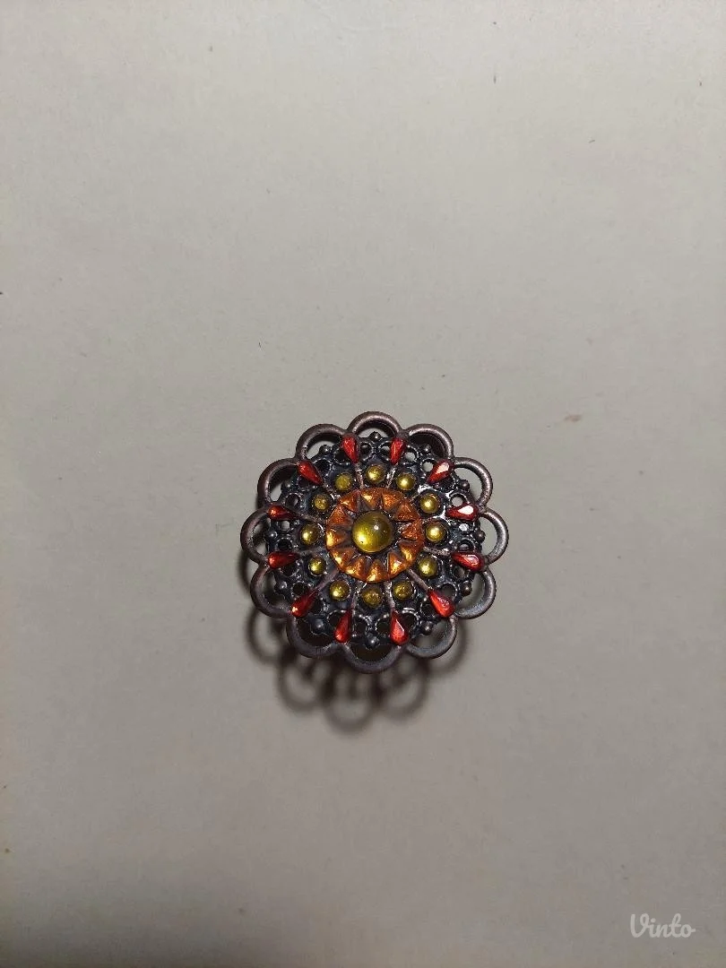 Okrugli bakarni broš