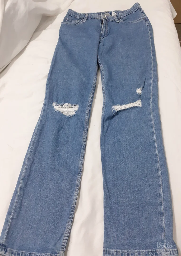 Plave pocepane ženske farmerice