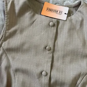 Ženski elegnantni prsluk