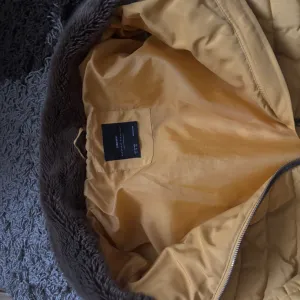 Zara žuta jakna sa krznom