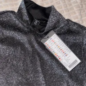 NewYorker- ženska polurolka sa šljokicam