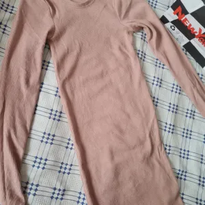 Trikotazna roze haljina uni