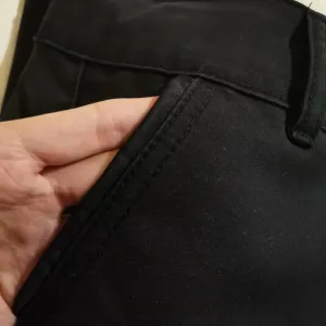 Ženske crne pantalone L-XL