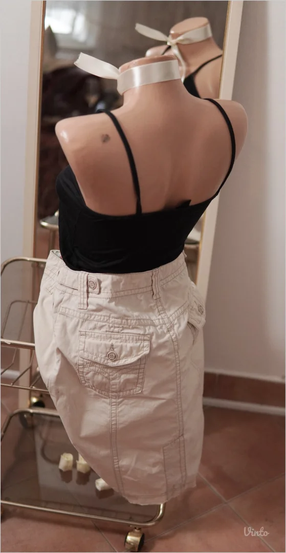 2.3.2. Esprit krem suknja M sa džepovima