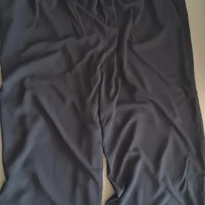 Crne 4XL pantalone