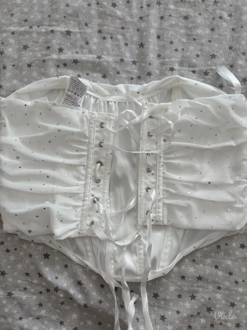 Beli korset s cirkonima