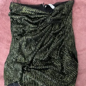 Šljokičava maslinasta suknja