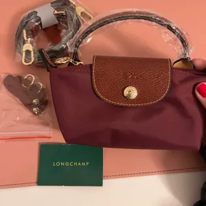 Original Longchamp mini torba (potpuno nova)