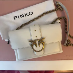 Pinko bela kožna torba sa lancem (kao nova)