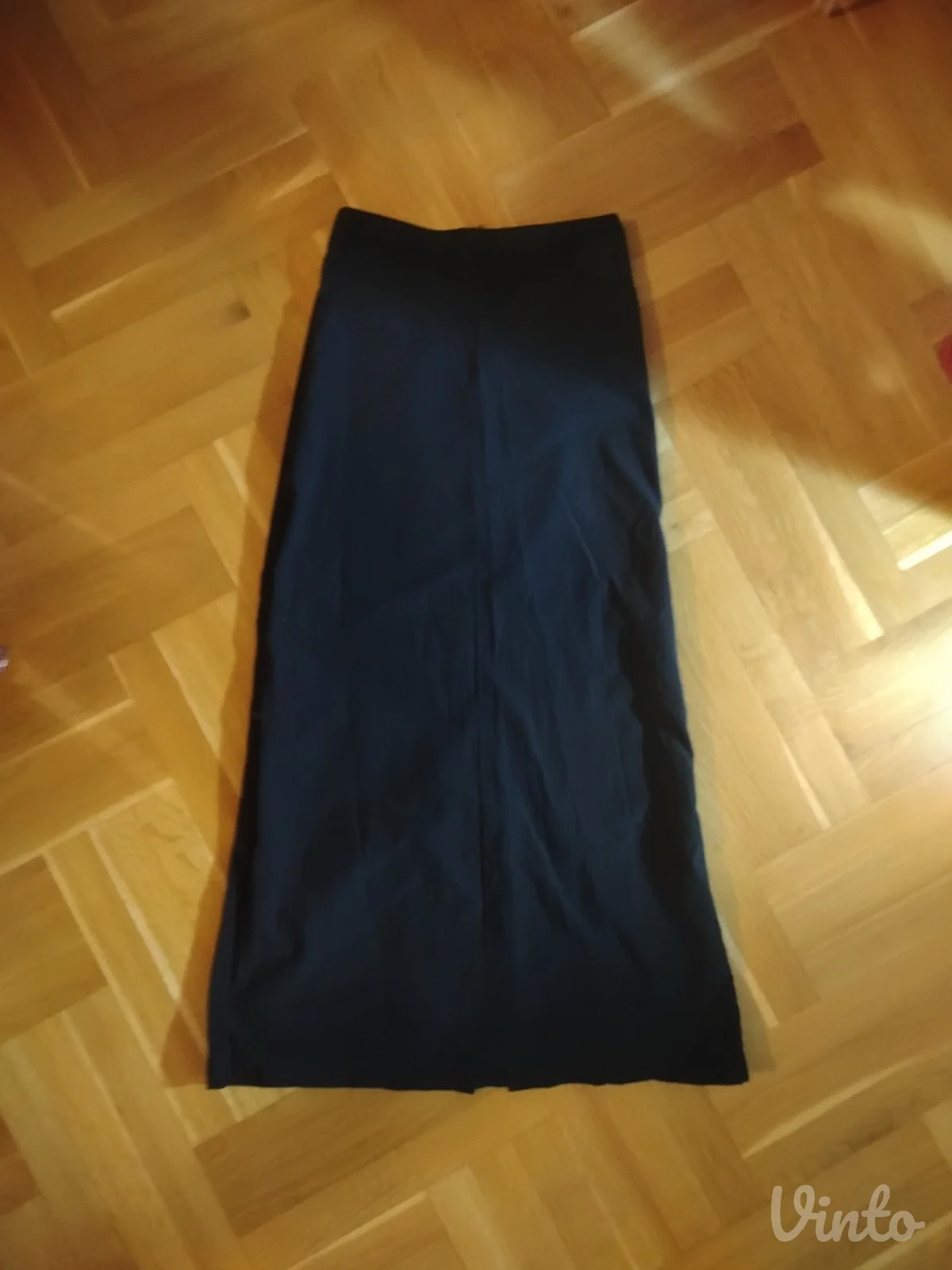 duga crna suknja sa džepovima