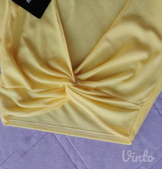 PLT nov rebrasti zuti crop top sa etiketom S