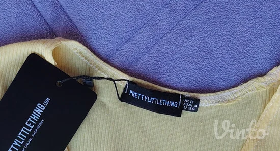 PLT nov rebrasti zuti crop top sa etiketom S