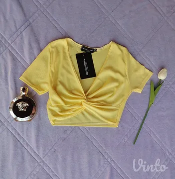 PLT nov rebrasti zuti crop top sa etiketom S