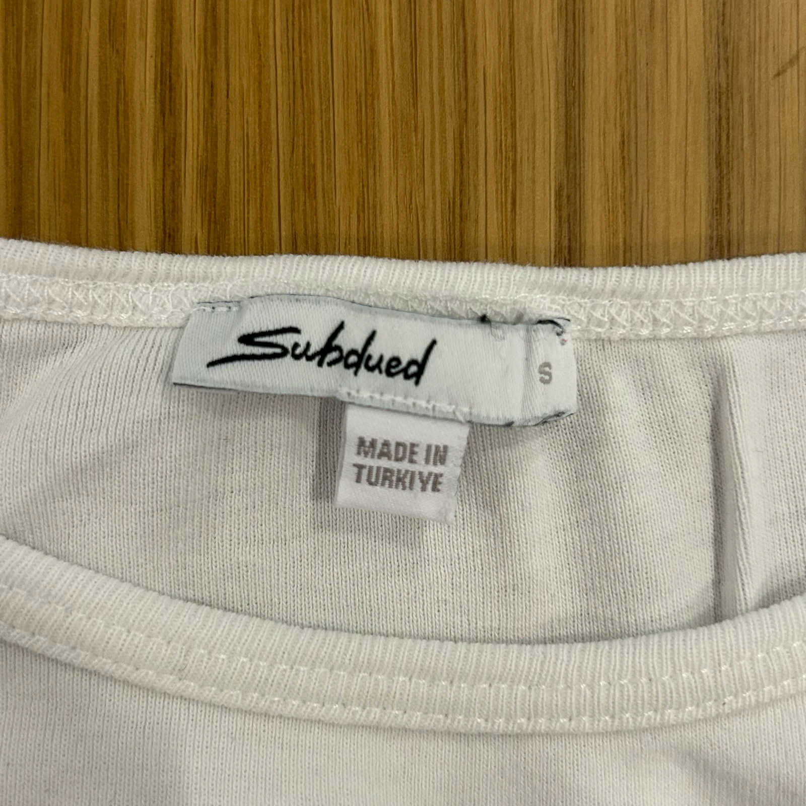Subdued - bela baby tee