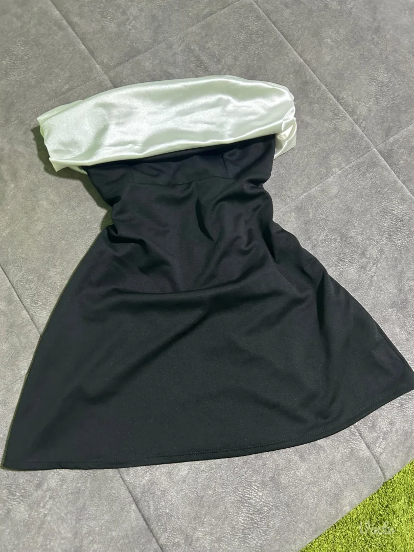 Elegantna crno-bela haljina sa mašnom