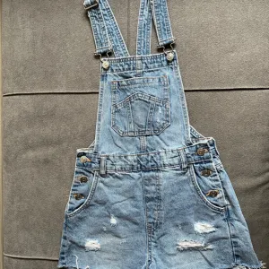 Ženski teksas kombinezon