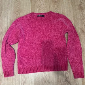 new yorker roze pleteni dzemper