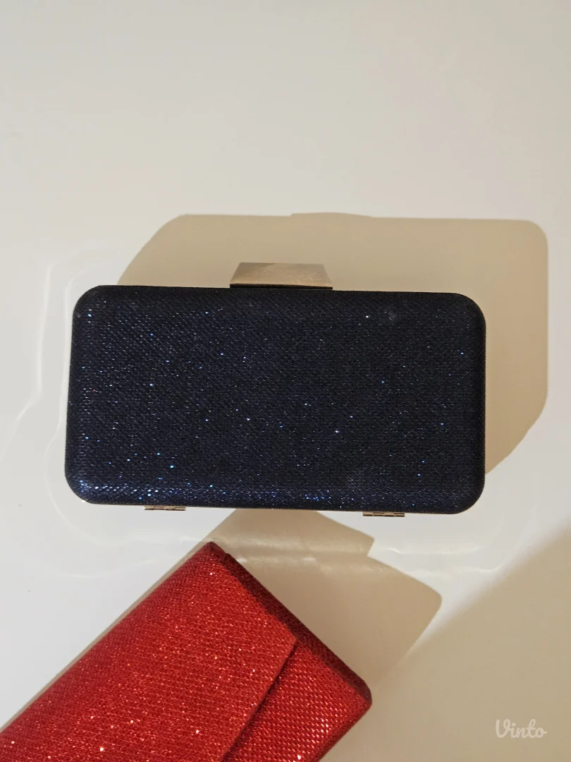 Teget i crvena elegantna clutch tobica