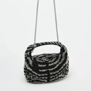 Zara torbica sa sjajnim perlicama