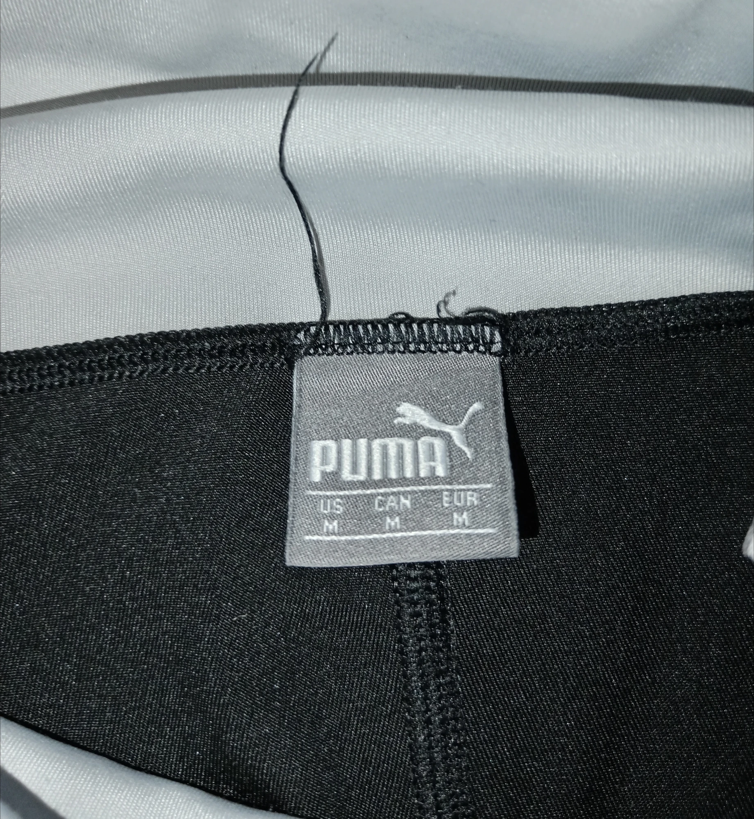 Puma crne helanke sa belim detaljima i natpisom / Vel. M