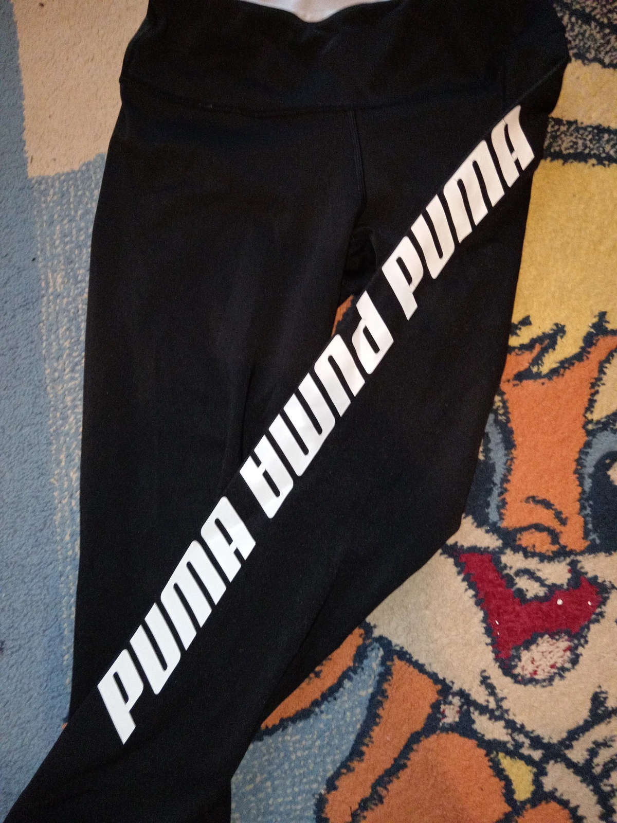 Puma crne helanke sa belim detaljima i natpisom / Vel. M