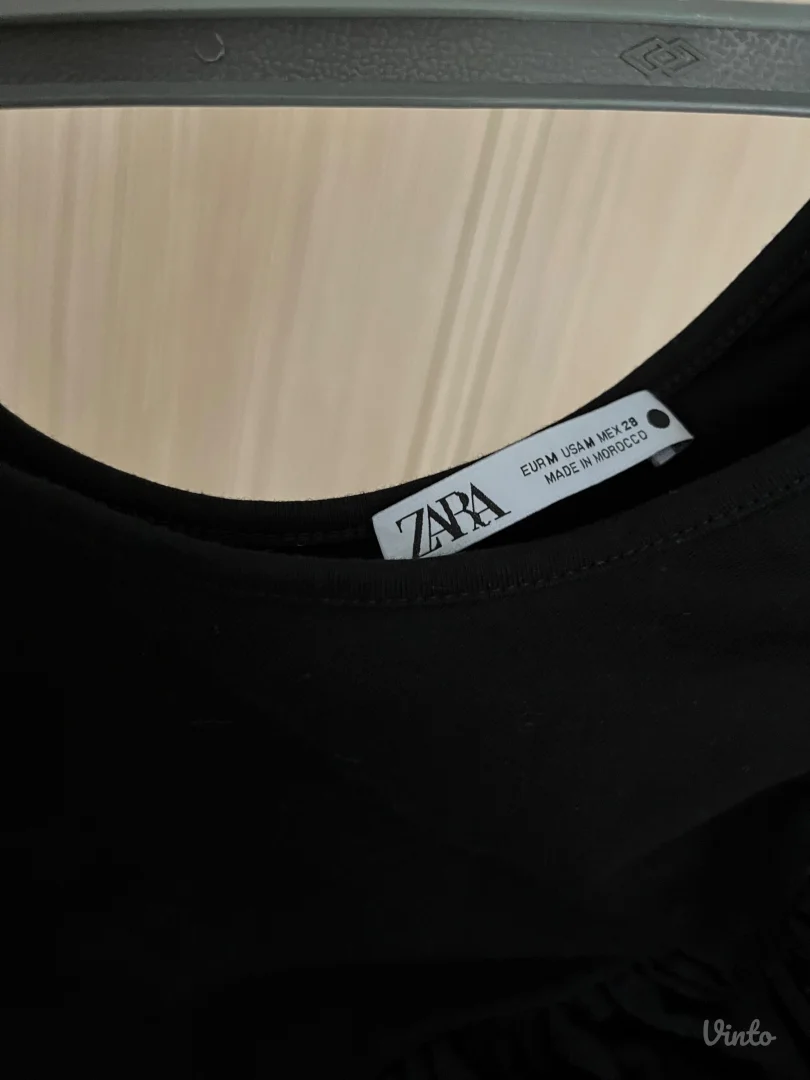 Crni bodi na jedno rame