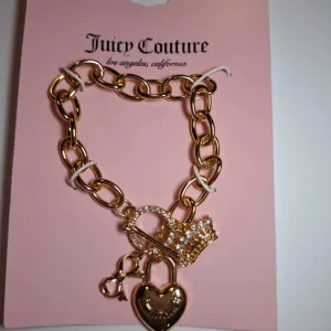 NOVA zlatna Juicy Couture narukvica sa privescima